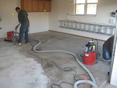 concrete grinding before a garage coating installation